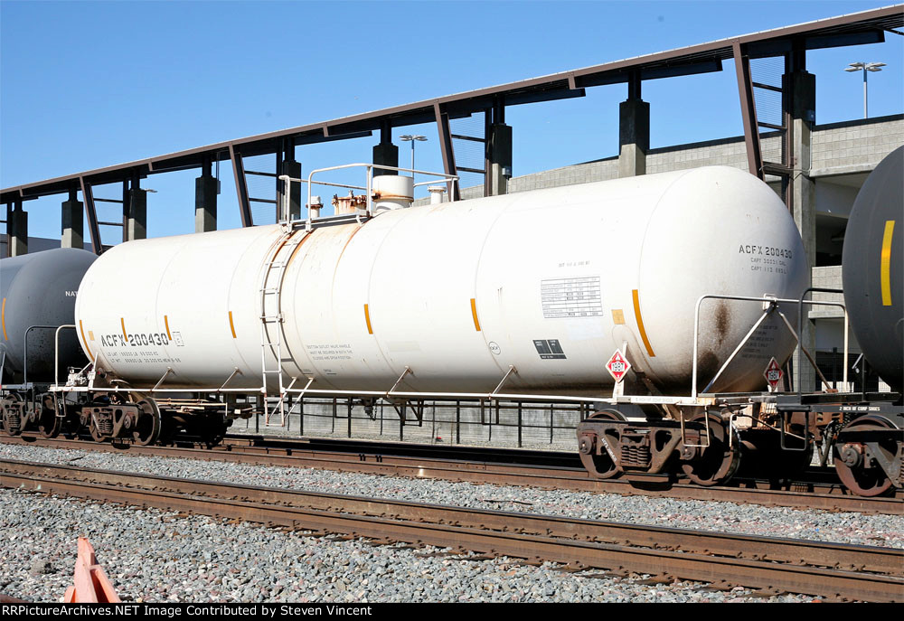 ACFX #200430 with 1987 placard (ethanol) in unit train.